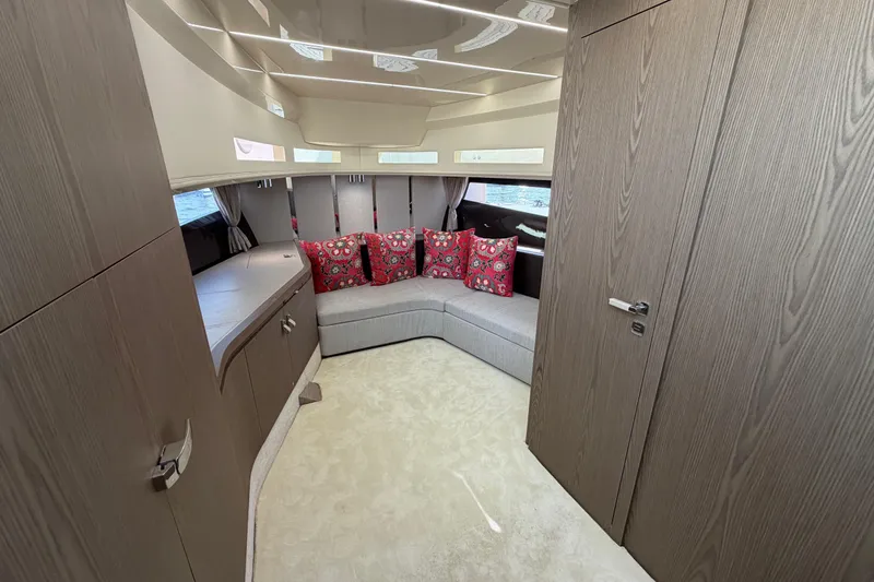 Slide: The Image of Luxurious interior of 2024 Invictus TT460 yacht with modern design and vibrant cushions. - 26