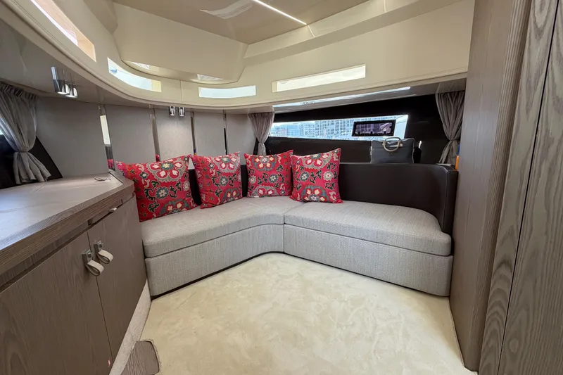 Slide: The Image of Luxurious interior of 2024 Invictus TT460 yacht with elegant seating and vibrant cushions. - 28