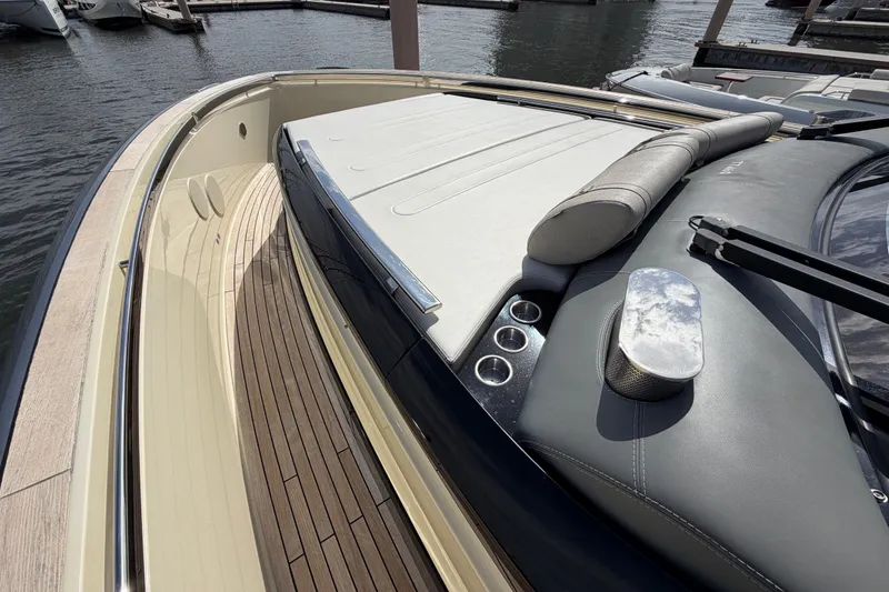 Slide: The Image of Luxurious 2024 Invictus TT460 yacht deck with sleek design and elegant wood finish. - 32