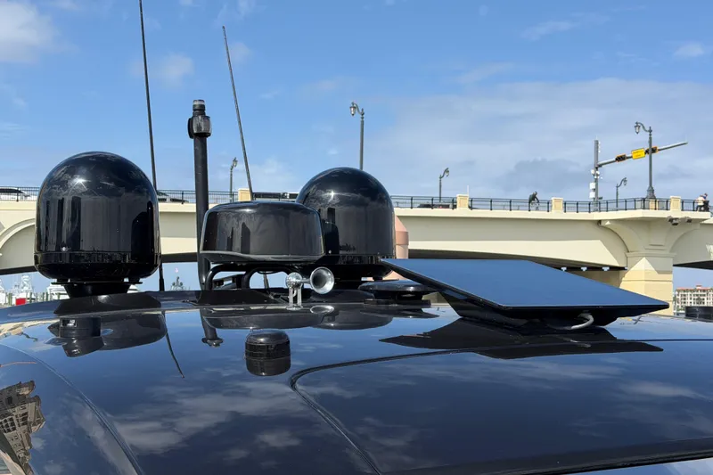 Slide: The Image of Rooftop technology setup on 2024 Invictus TT460, featuring antennas and a solar panel. - 36