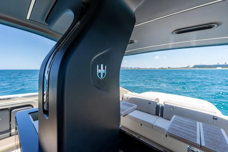 Slide: The Image of 2024 Invictus TT460 yacht interior with ocean view, featuring sleek design and comfortable seating. - 42