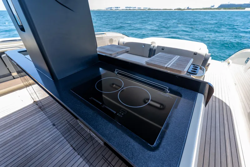 Slide: The Image of Luxury yacht Invictus TT460 2024 with sleek outdoor kitchen and ocean view. - 45