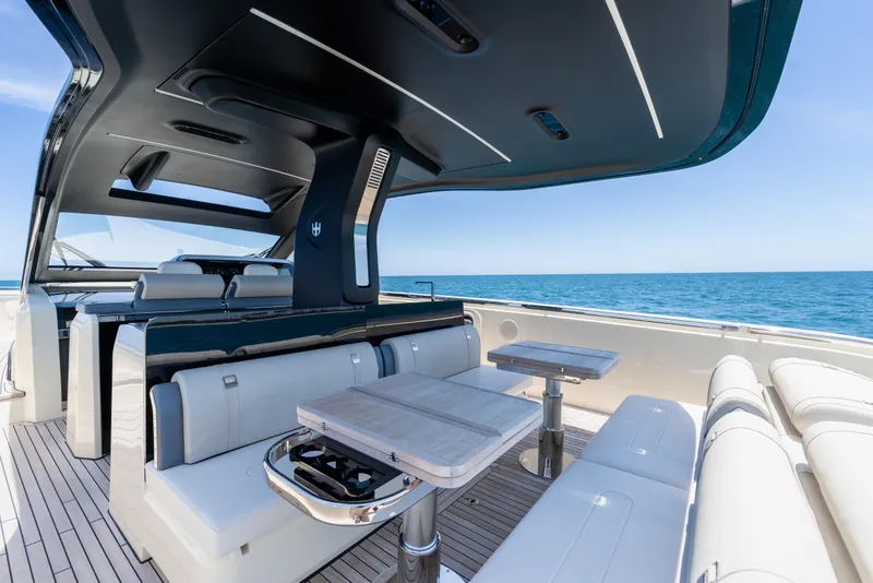Slide: The Image of Luxurious 2024 Invictus TT460 yacht interior with elegant seating and ocean view. - 49