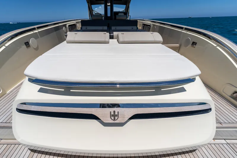 Slide: The Image of Luxurious 2024 Invictus TT460 yacht deck with sunbathing area, cruising on open sea. - 52