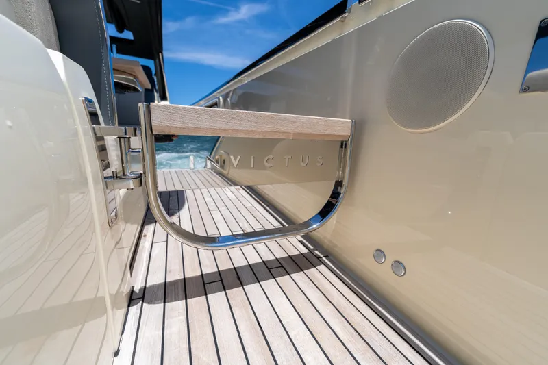Slide: The Image of 2024 Invictus TT460 yacht deck with sleek design and luxury features. - 57
