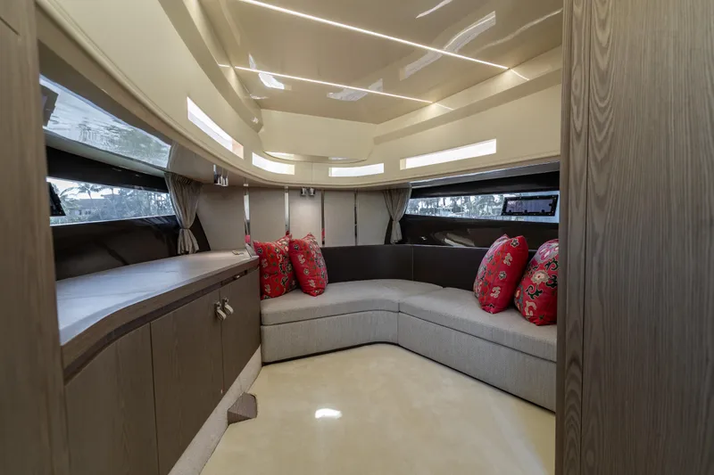 Slide: The Image of Luxurious interior of 2024 Invictus TT460 yacht with elegant seating and decorative pillows. - 61
