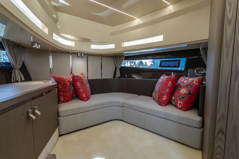 Slide: The Image of Luxurious interior of 2024 Invictus TT460 yacht with elegant seating and vibrant red cushions. - 63