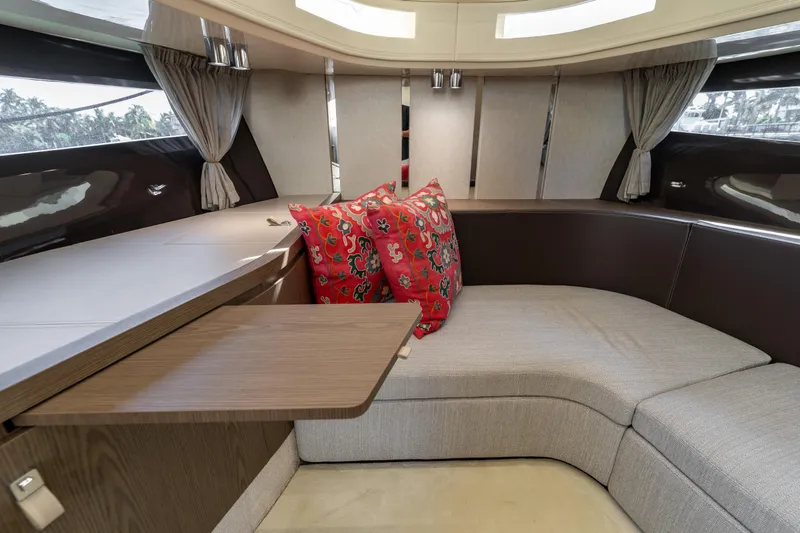 Slide: The Image of Luxurious interior of 2024 Invictus TT460 yacht with elegant seating and vibrant cushions. - 65