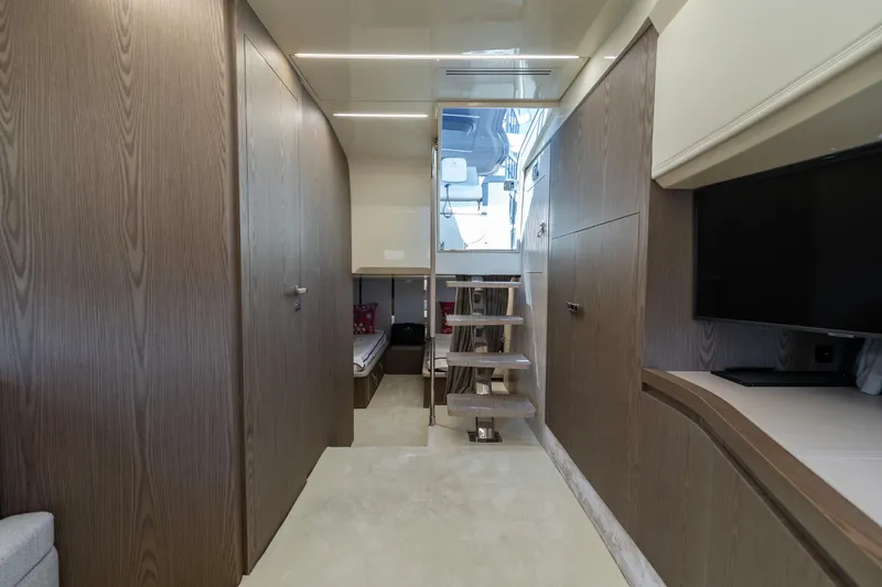 Slide: The Image of Luxurious interior of 2024 Invictus TT460 yacht with modern wood finishes and sleek design. - 68