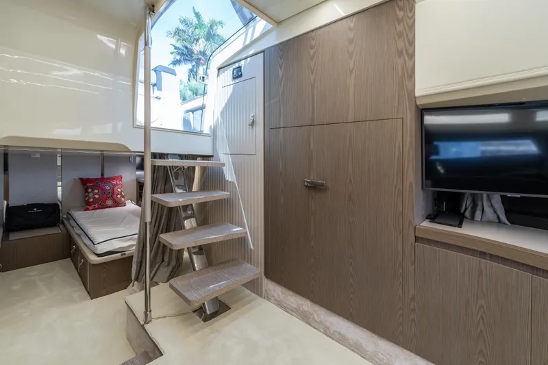 Slide: The Image of Luxurious interior of 2024 Invictus TT460 yacht with modern design and wooden finishes. - 69