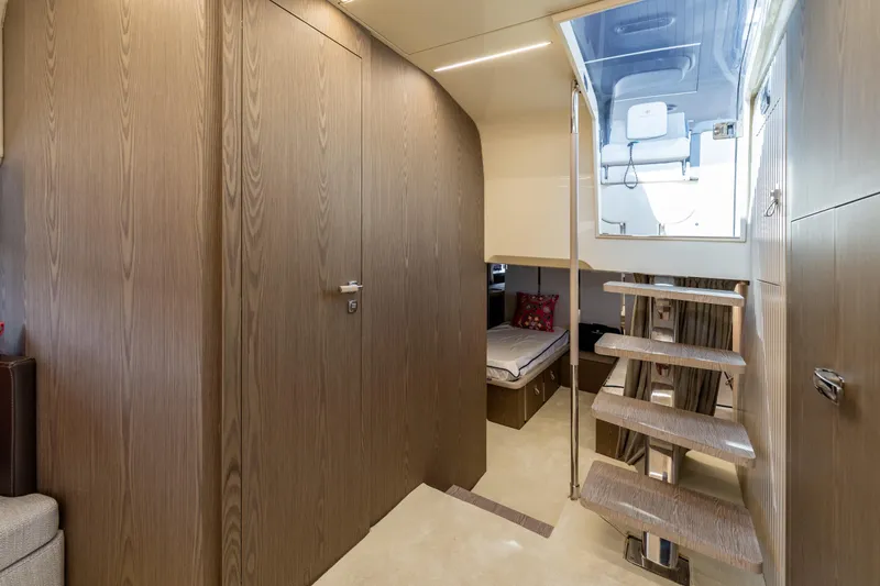 Slide: The Image of Luxurious interior of 2024 Invictus TT460 yacht with wooden finishes and modern staircase. - 70