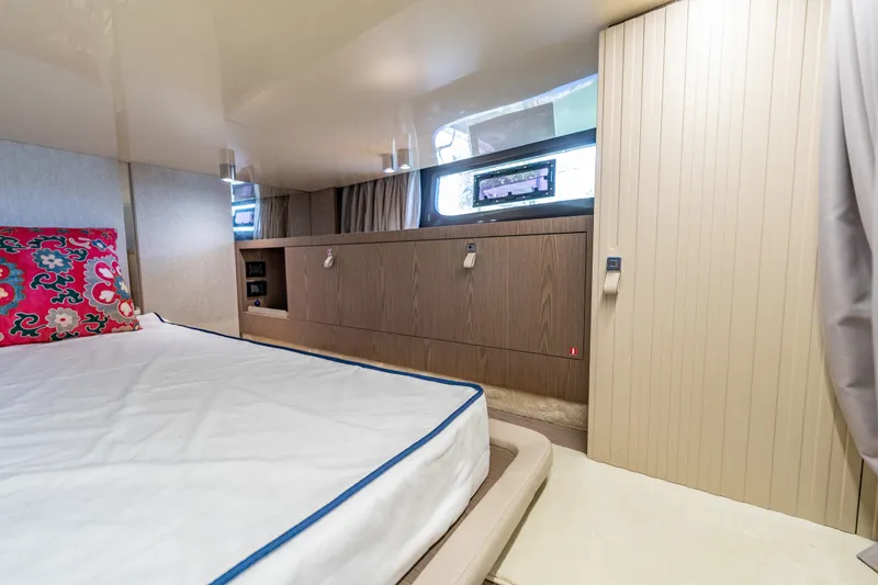Slide: The Image of Luxurious cabin interior of 2024 Invictus TT460 yacht with modern design and vibrant decor. - 80