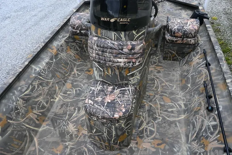 Slide: The Image of 2023 War Eagle 961 Blackhawk boat with camouflage interior design. - 10
