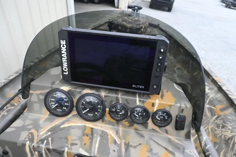 Slide: The Image of 2023 War Eagle 961 Blackhawk dashboard with Lowrance Elite fishfinder and gauges. - 11