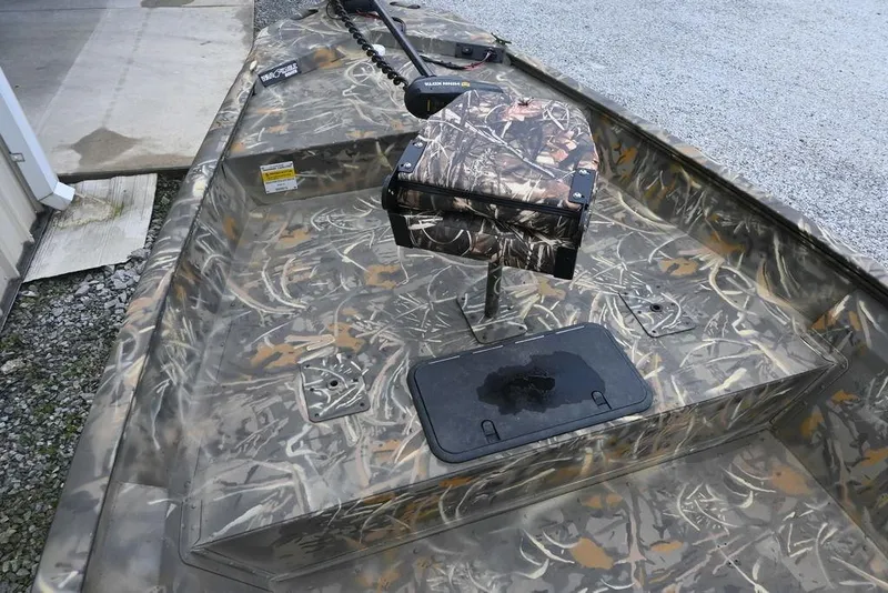 Slide: The Image of 2023 War Eagle 961 Blackhawk boat with camouflage interior and mounted seat. - 7