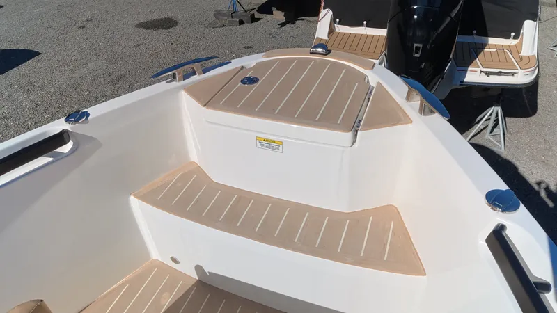 Slide: The Image of The image shows the bow deck of a 2027 Saxdor 320 GTO with wood paneling. - 35