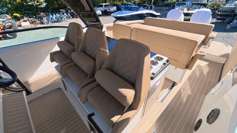 Slide: The Image of The image shows the interior of a 2027 Saxdor 320 GTO with beige, cushioned seats. - 14