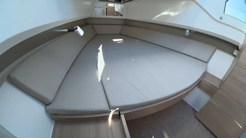 Slide: The Image of The 2027 Saxdor 320 GTO features a spacious cabin with a large, cushioned lounging area. - 27