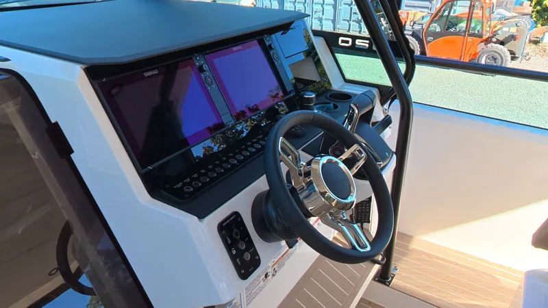 Slide: The Image of The image shows the helm of a Saxdor 320 GTO with modern instruments and a sleek steering wheel. - 16