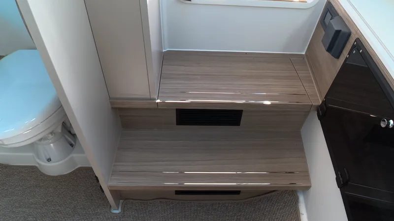 Slide: The Image of Interior of the Saxdor 320 GTO with wooden steps and a toilet. - 22