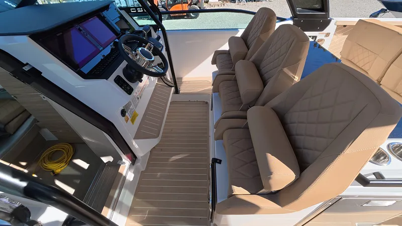 Slide: The Image of The image shows the interior of a 2027 Saxdor 320 GTO with beige leather seats and a modern helm console. - 13