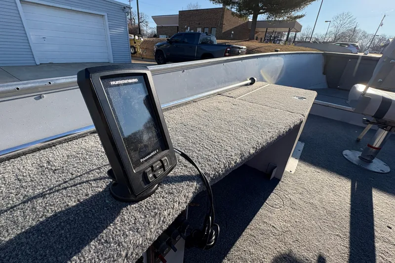 Slide: The Image of 1995 Lund 1440-V Rebel Tiller boat interior with Humminbird fish finder. - 14