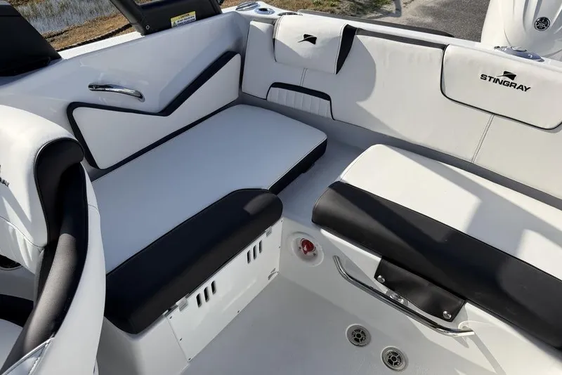 Slide: The Image of 2026 Stingray 20 SBX boat interior with sleek white and black seating design. - 15