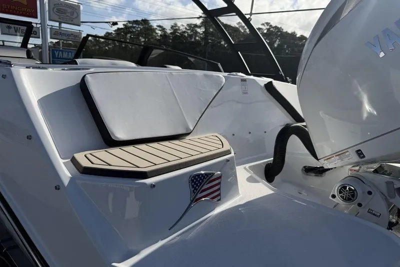 Slide: The Image of 2026 Stingray 20 SBX boat with Yamaha engine, featuring sleek design and American flag detail. - 17