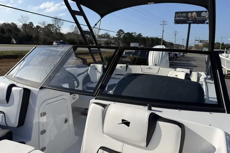 Slide: The Image of 2026 Stingray 20 SBX boat interior with sleek white seating and modern design. - 18