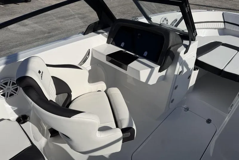 Slide: The Image of 2026 Stingray 20 SBX boat interior with sleek white and black seating design. - 8