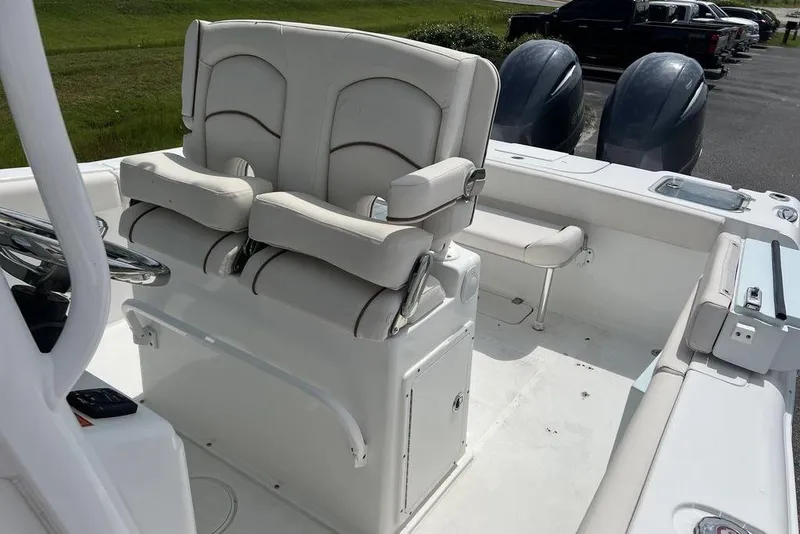 Slide: The Image of 2026 Sea Hunt Gamefish 25 boat interior with dual seats and twin engines. - 15