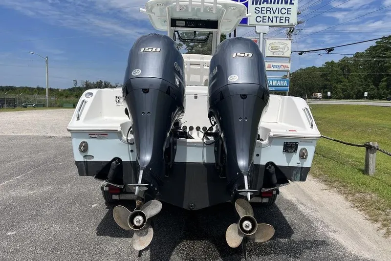 Slide: The Image of 2026 Sea Hunt Gamefish 25 with dual Yamaha 150 engines at marine service center. - 20
