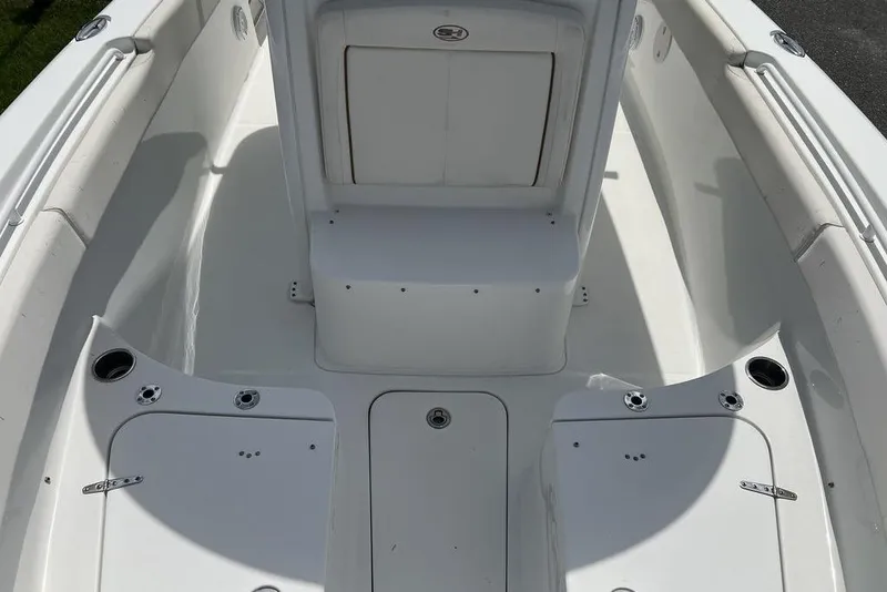 Slide: The Image of 2026 Sea Hunt Gamefish 25 boat interior, featuring spacious seating and storage compartments. - 28