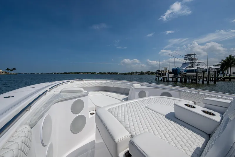 Slide: The Image of Luxurious HCB 48 Campeon boat, 2025 model, on calm waters. - 19