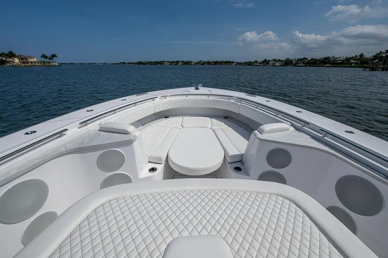 Slide: The Image of Luxurious HCB 48 Campeon boat, 2025 model, on calm waters. - 20