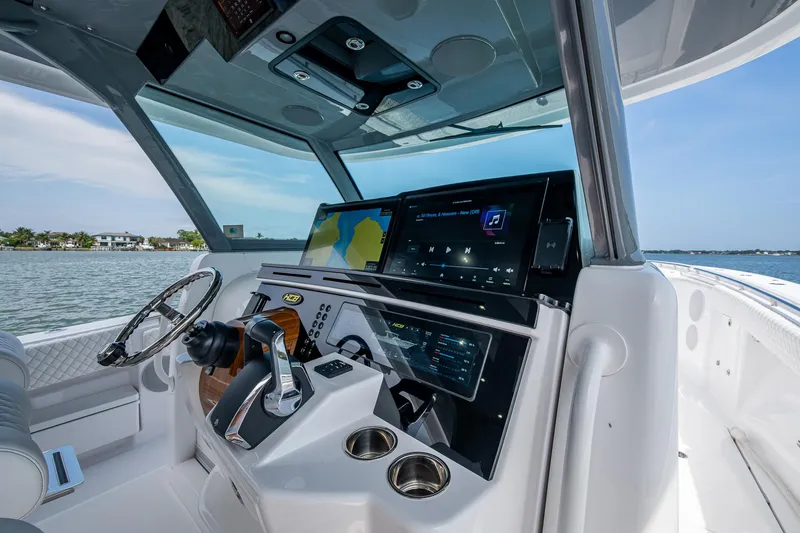 Slide: The Image of 2025 HCB 48 Campeon boat cockpit with advanced navigation system and sleek design. - 27