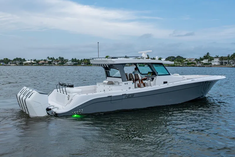 Slide: The Image of 2025 HCB 48 Campeon boat cruising on calm water, showcasing sleek design and powerful engines. - 3