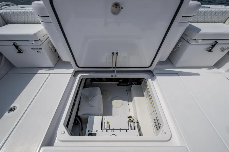 Slide: The Image of HCB 48 Campeon 2025 boat storage compartment open, showcasing interior details. - 44