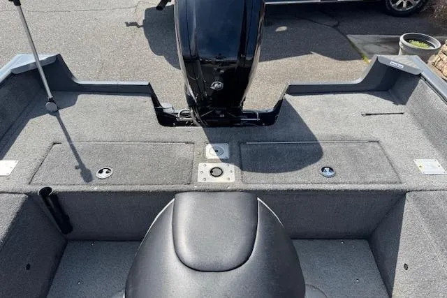 Slide: The Image of 2018 Tracker Pro Guide V-175 SC boat interior with motor and seating. - 10