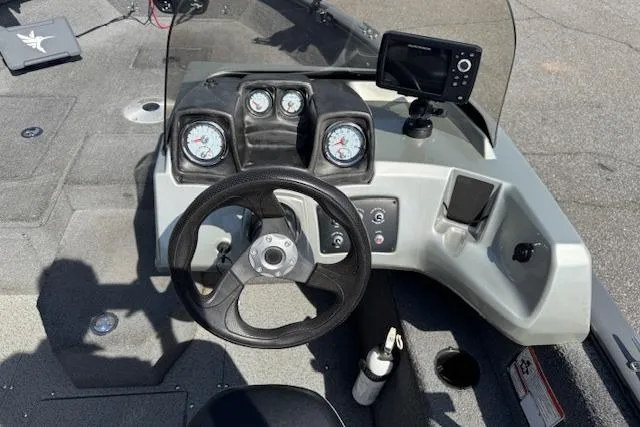 Slide: The Image of 2018 Tracker Pro Guide V-175 SC boat dashboard with steering wheel and gauges. - 11
