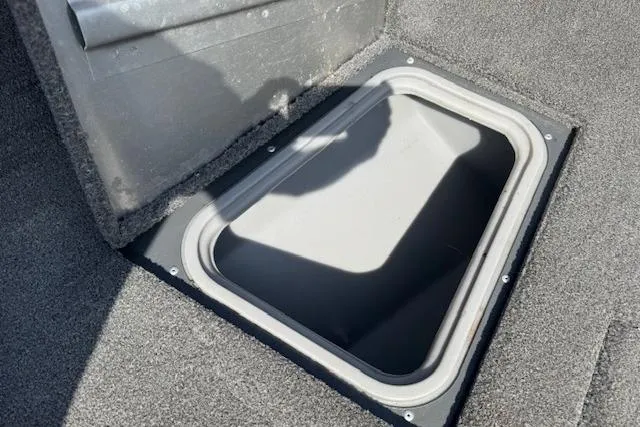 Slide: The Image of 2018 Tracker Pro Guide V-175 SC boat storage compartment with open hatch. - 13