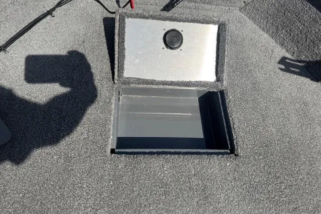 Slide: The Image of 2018 Tracker Pro Guide V-175 SC boat storage compartment with open lid. - 14