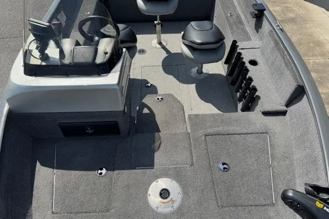 Slide: The Image of 2018 Tracker Pro Guide V-175 SC boat interior with seating and storage compartments. - 8