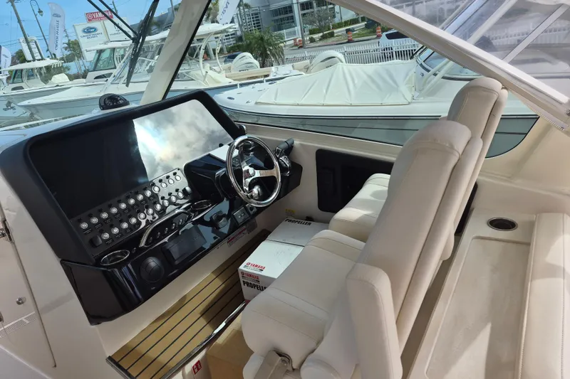 Slide: The Image of 2026 Grady-White Freedom 345 boat interior with modern dashboard and seating. - 10