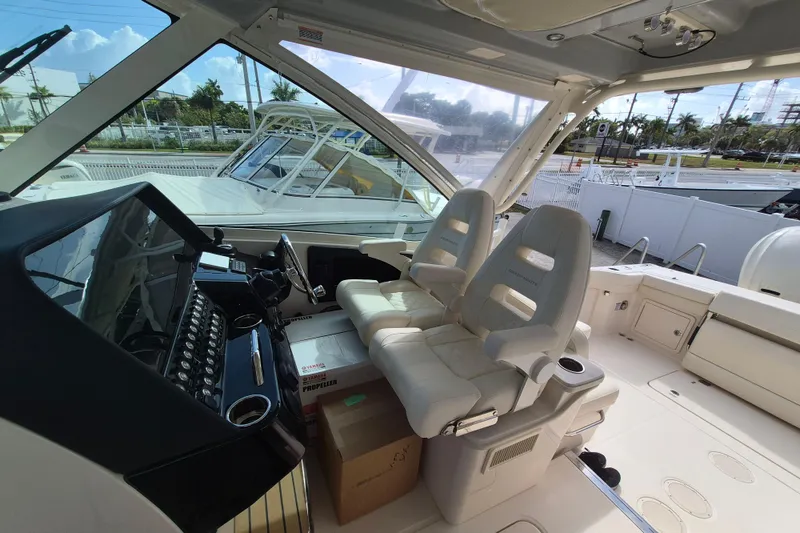 Slide: The Image of 2026 Grady-White Freedom 345 boat interior with helm and seating area. - 12