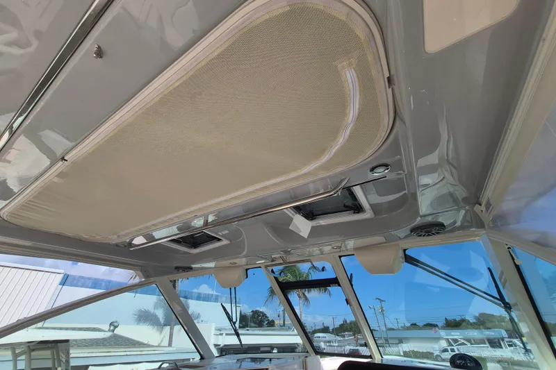 Slide: The Image of 2026 Grady-White Freedom 345 boat interior ceiling with sunroof and speakers. - 13