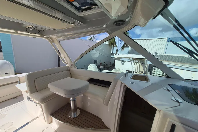 Slide: The Image of 2026 Grady-White Freedom 345 boat interior with seating and table, showcasing luxury design. - 15