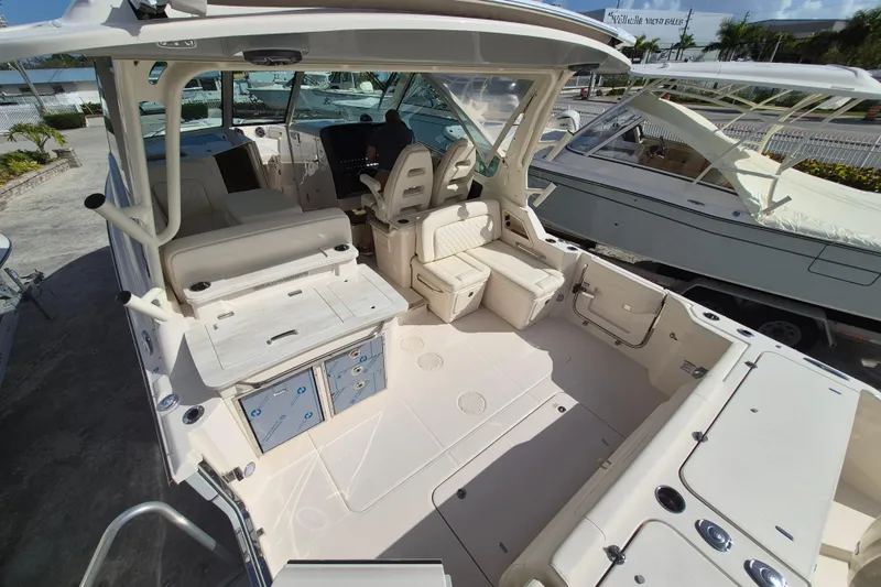 Slide: The Image of 2026 Grady-White Freedom 345 boat interior with seating and storage compartments. - 17