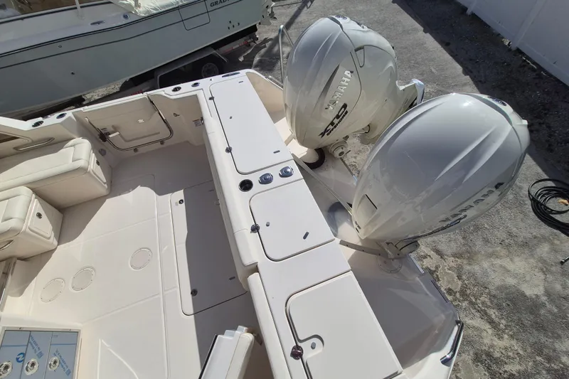 Slide: The Image of 2026 Grady-White Freedom 345 boat with dual Yamaha outboard engines, spacious deck view. - 18