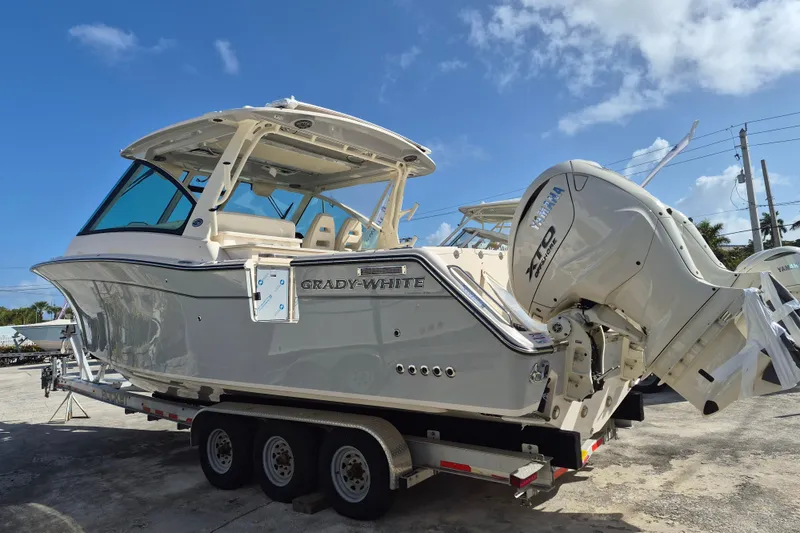 Slide: The Image of 2026 Grady-White Freedom 345 boat on trailer, featuring Yamaha outboard engines. - 4